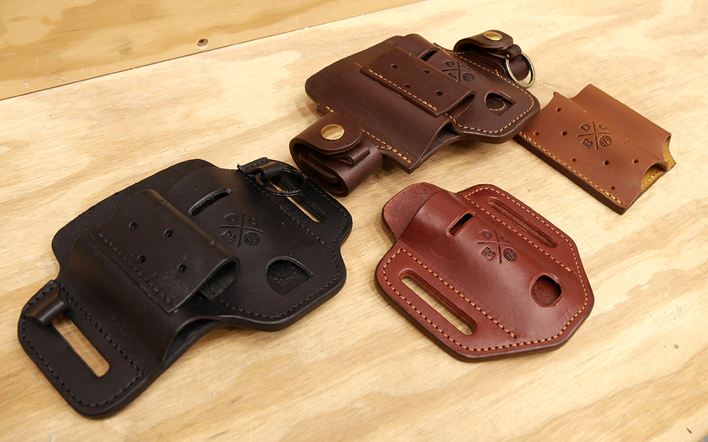Four different styles of 1791 EDC leather toolbelt organizers. Styles and colors include Large Easy-Slide Flex in black, Large Action-Snap Flex in burgundy, Easy-Slide Solo in chestnut, and Pocket Duo in chestnut.