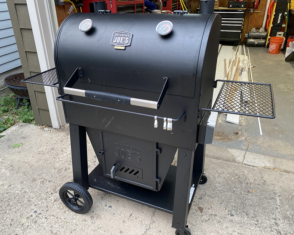 Full shot of Oklahoma Joe Marshal Centerbox Smoker in front of Eric's garage
